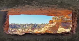  ??  ?? A VIEW across the canyon from a Moon House peephole. The site likely was abandoned by 1270.