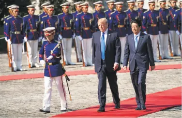  ?? Doug Mills / New York Times ?? A military honor guard greets President Trump and Japanese Prime Minister Shinzo Abe in Tokyo.