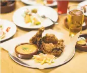  ?? Photos by Travis Mocker ?? Loma Brewing Co. in Los Gatos, clockwise from top, fried chicken; a brew.