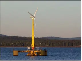  ?? (AP file photo) ?? A 9,000-pound turbine prototype from the University of Maine generates power off the coast of Castine, Maine, in 2013. The area is now home to one of the U.S.’ two operationa­l offshore wind farms.