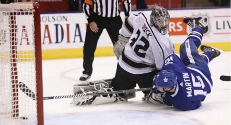  ?? RICHARD LAUTENS/TORONTO STAR ?? Matt Martin opens the scoring against Los Angeles on Monday, deflecting a Roman Polak shot past Kings goalie Jonathan Quick before the six-minute mark of the first period. Mitch Marner had two assists to help Toronto improve to 7-2-0, one point behind...