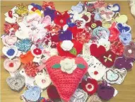  ??  ?? Pictured are hearts created by Leicesters­hire people that were sent to Manchester and London following the terrorist attacks.