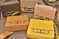  ??  ?? Logo rhythm: CH Carolina Herrera Initials Insignia bags