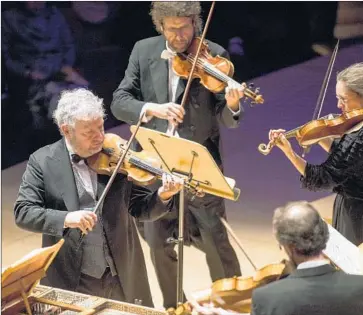  ?? Photograph­s by Kent Nishimura Los Angeles Times ?? SICILIAN violinist Fabio Biondi, left, performs with members of his early music ensemble Europa Galante.