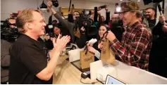  ?? (Chris Wattie/Reuters) ?? CANOPY GROWTH CEO Bruce Linton applauds after selling the first legal recreation­al marijuana after midnight on Tuesday at a Tweed retail store in St John’s, Newfoundla­nd and Labrador.