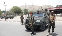  ?? Reuters/Omar Sobhani ?? ON GUARD: Afghan security forces keep watch at the site of a suicide attack in Kabul, Afghanista­n June 4, 2018.-