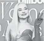  ?? ?? Donning a two- tone bronze gown and mauve latex gloves, Grammy winner Kim Petras said, “I love working, so I celebrate by going even harder.”