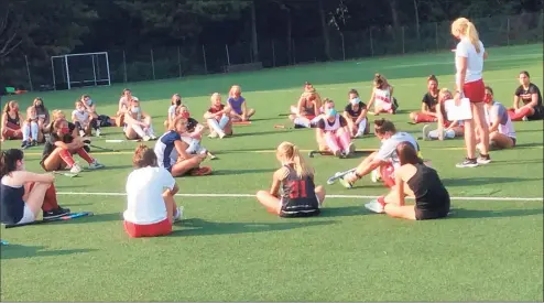  ?? David Fierro / Hearst Connecticu­t Media ?? Greenwich field hockey coach Megan Wax addresses her team prior to practice on Friday, Sept. 25, 2020 in Greenwich, Connecticu­t.