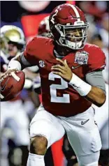  ??  ?? Freshman Jalen Hurts, left, went 7-for-14 for 57 yards in Alabama’s semifinal win over Washington. Deshaun Watson, the Heisman Trophy runner-up, has thrown for 38 touchdowns to 17 intercepti­ons this season.