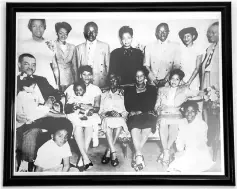  ??  ?? A family photo hangs in the living room of Rayford’s home in Washington, D.C.