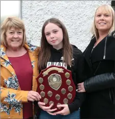  ??  ?? At the graduation ceremony for sixth class of Ballymitty National School on Monday evening was Pupil of the year (Girl) Ciara Roche who received the Mairead Ffrench Perpetual Trophy. From left: Christine Frisby, Ciara Roche, and Gillian Roche.