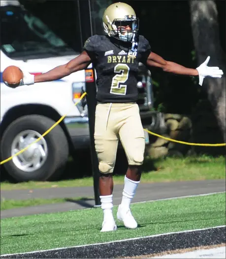 ?? Photo by Ernest A. Brown ?? Jean Constant celebrates after scoring a touchdown against Division II New Haven this past season. Constant plans to return to Bryant for what will be his fifth year on the Smithfield campus. He was redshirted during his freshman season with the Bulldogs.