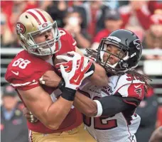  ??  ?? KYLE TERADA, USA TODAY SPORTS 49ers tight end Garrett Celek, left, had two touchdown catches in the first half against the Falcons.