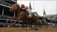  ?? AP ?? LIGHTNING STRIKES: Rich Strike, with Sonny Leon aboard, wins the 148th running of the Kentucky Derby.
