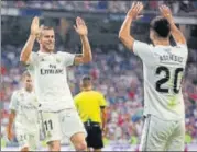 ?? AP ?? ▪ Real Madrid’s Gareth Bale (left) celebrates with Marco Asensio after scoring their second goal against Getafe on Sunday.
