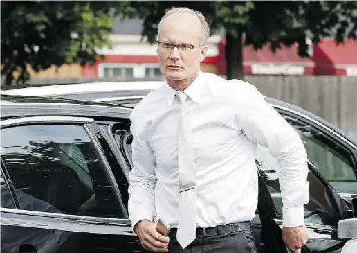  ?? Jim Mone /the asociated pres ?? U.S. dentist Walter Palmer arrives back at his office following a lunch break in Bloomingto­n, Minn., in September. Following the July controvers­y over his shooting of a lion in Zimbabwe, officials now say all his papers were in order.