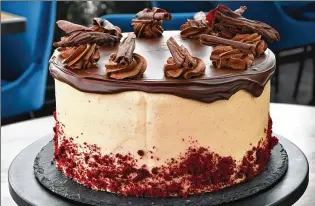  ?? CHRIS HUNT FOR THE AJC ?? 5Church’s Red Velvet Layer Cake with Cream Cheese Frosting and Chocolate Ganache.