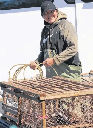  ?? LOGAN MACLEAN • THE GUARDIAN ?? Kyle Sark, captain of the Way Point lobster boat that is taking part in the Lennox Island moderate livelihood fishery, says everything has been peaceful on the water since the fishery launched on May 7.