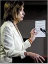  ?? AP/ANDREW HARNIK ?? House Speaker Nancy Pelosi reads Thursday from a paper titled “Know Your Rights” in regard to the planned Immigratio­n and Customs Enforcemen­t operation.