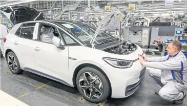  ?? REUTERS ?? Volkswagen AG committed more than $40 billion to selling 28 million electric cars by 2028 but has struggled to finish its ID.3, the first in a new line of such vehicles.