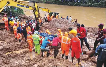  ?? ANI ?? ■ The National Disaster Response, State Disaster Response Fund and Police personnel conduct a search and rescue operation at a flood-affected area in Kerala on Monday.