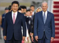  ?? CAROLYN KASTER / AP ?? Vice President Joe Biden greeted Chinese President Xi Jinping during a ceremony at Andrews Air Force Base, Maryland, on Sept. 24, 2015. China has fast become a top election issue as Trump and Biden engage in a verbal brawl over who’s better at playing the tough guy.