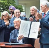  ?? JIM LO SCALZO, EUROPEAN PRESSPHOTO AGENCY ?? President Trump signed an executive order on religious liberty May 4 that paves the way for health officials to roll back Obamacare’s mandate on birth control coverage.