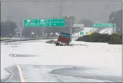  ?? ALAN DEP — MARIN INDEPENDEN­T JOURNAL ?? A truck sits in flood water along westbound Highway 37 near Highway 101 in Novato in 2019.