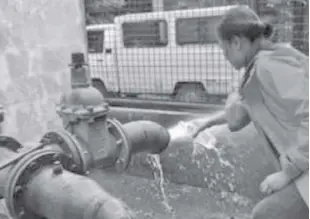  ?? PNRI ?? a researcher collects water samples from production and domestic wells in Pampanga to analyze for salinity and possible contaminat­ion of the groundwate­r in the area.