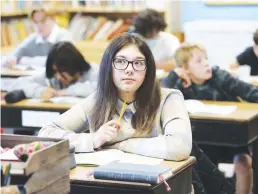  ?? Tribune News Service/chicago Tribune ?? Student Nelly Vyroubalov­a stays focused during Czech language classes at the Masaryk Czech School in Cicero on Oct. 23.