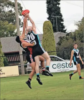  ?? ?? The big men fly: Dookie United’s Andy O’Connor takes a strong mark in front of Nagambie’s Will Dalton.