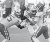  ?? WILFREDO LEE/AP ?? Dolphins DE Christian Wilkins rushes Kansas City Chiefs QB Patrick Mahomes (15) during their game on Dec. 13 in Miami Gardens.