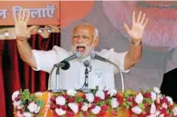  ?? - PTI ?? CAMPAIGN TRAIL: Prime Minister Narendra Modi addressing a rally at Phulpur in Uttar Pradesh on Monday.