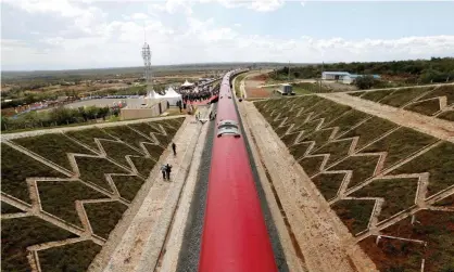  ?? Photograph: Thomas Mukoya/Reuters ?? A train on a line constructe­d by the China Road and Bridge Corporatio­n and financed by Chinese government in Kimuka, Kenya.