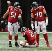  ?? CURTIS COMPTON / AJC 2019 ?? Alex Mack (51) and Jake Matthews (70) are keen to provide QB Matt Ryan (2) and the Falcons offense a line with full buy-in as they try to get back to some of the league’s best zone blocking.