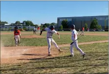  ?? MIKE CABREY — MEDIANEWS GROUP ?? La Salle’s Brian Baquero (13, left) celebrates with teammate Tommy Convey (11) after Brian Baquero scored in the third inning against Pennsbury in their PIAA-6A first round game on Monday.