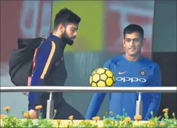  ??  ?? Virat Kohli and MS Dhoni play football after India’s training session was cancelled due to rain in Ranchi on Friday. AFP