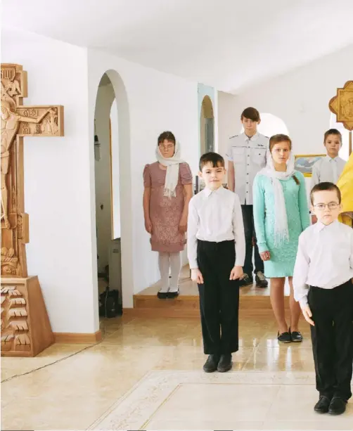  ?? Photograph­s by Mikhail Mordasov ?? Vladimir Putin may only have two children of his own but, with Russia facing a population crisis, he’s bribing other parents to have, and adopt, as many as possible. Marcel Theroux visits the country’s super-families.