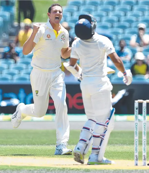  ??  ?? SATISFYING RESULT: Australian bowler Josh Hazlewood (left) reacts after dismissing Indian batsman Ajinkya Rahane.