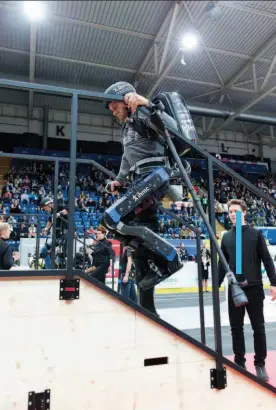  ??  ?? Left: Mark Daniel climbs the stair challenge in the powered exoskeleto­n competitio­n at Cybathlon 2016. Right: Daniel traverses the stepping stones during the exo competitio­n. The team elected to have him skip the tilted ramp task, which had proven too risky during practise runs at the IHMC lab in Pensacola.