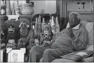  ?? DENIS FARRELL, FILE/AP PHOTO ?? South African photograph­er Peter Magubane speaks with The Associated Press during an interview at his home in Johannesbu­rg on June 2, 2016.