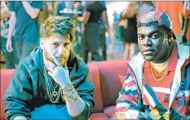  ?? YouTube ?? ADAM PALLY, left, and Sam Richardson play buddies who suddenly go from jet set to hometown joke in the new YouTube Premium series “Champaign ILL.”