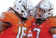  ?? [PHOTO BY BRYAN TERRY, THE OKLAHOMAN] ?? OSU defensive backs Devin Harper, left, and Ramon Richards celebrate during the Cowboys’ big win over Baylor. Bigger games await, beginning this Saturday at Texas.