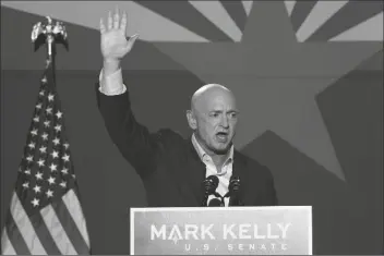  ?? ASSOCIATED PRESS ?? MARK KELLY, ARIZONA DEMOCRATIC SENATOR, waves to supporters as he speaks during an election night event Nov. 3 in Tucson.