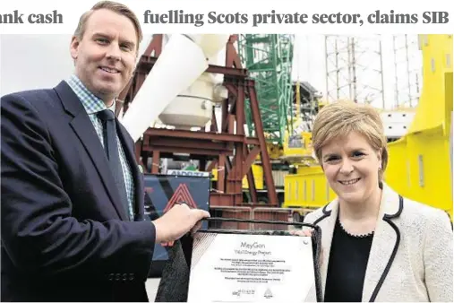  ??  ?? FUNDED: Tim Cornelius, chief executive of Atlantis Resources, seen with First Minister Nicola Sturgeon, has benefited from SIB cash