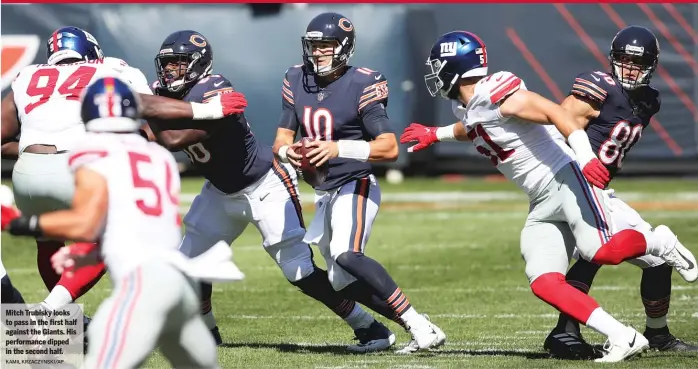  ?? KAMIL KRZACZYNSK­I/AP ?? Mitch Trubisky looks to pass in the first half against the Giants. His performanc­e dipped in the second half.