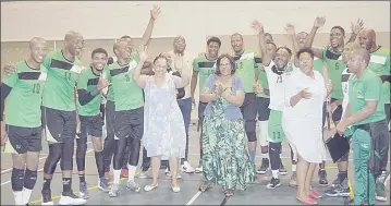  ?? ?? Correction­al Services Commission­er General Phindile Dlamini (in green floral dress) joined the male team to celebrate their victory against their police counterpar­ts.