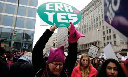 ?? Photograph: Joshua Roberts/Reuters ?? A demonstrat­or holds a sign supporting the Equal Rights Amendment during the Women’s March in Washington DC, on 19 January 2019.