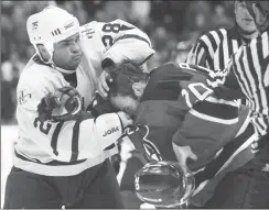  ?? Canadian Press file photo ?? Tie Domi, left, was known for his fighting prowess during his National Hockey League career, but he wanted to focus on positive things in his autobiogra­phy.