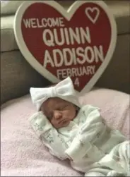  ?? MAYOR CHASE RITENAUER VIA TWITTER ?? Lorain Mayor Chase Ritenauer, with his wife, Lisa, used Twitter Feb. 10 to publish this photo of Quinn Addison, their new baby daughter.